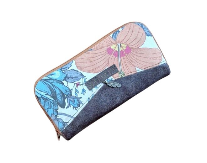 Ladies wallet made out of dark brown genuine leather and floral print.